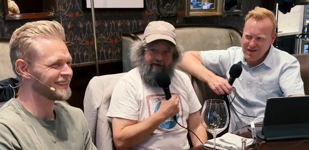 Kevin Magnussen, Anders Lund Madsen, and Anders Breinholt recording a podcast at a restaurant setting