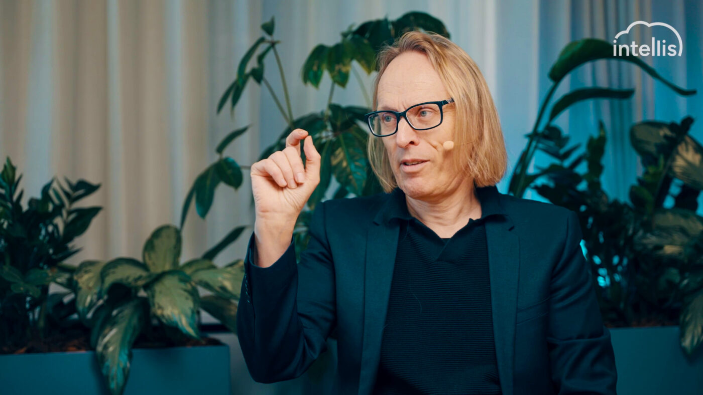 Morten Irgens speaking during an Intellis podcast episode, gesturing while making a point.